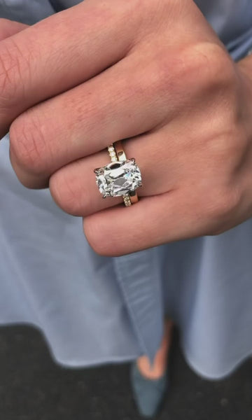 A cushion cut solitaire worn on the hand