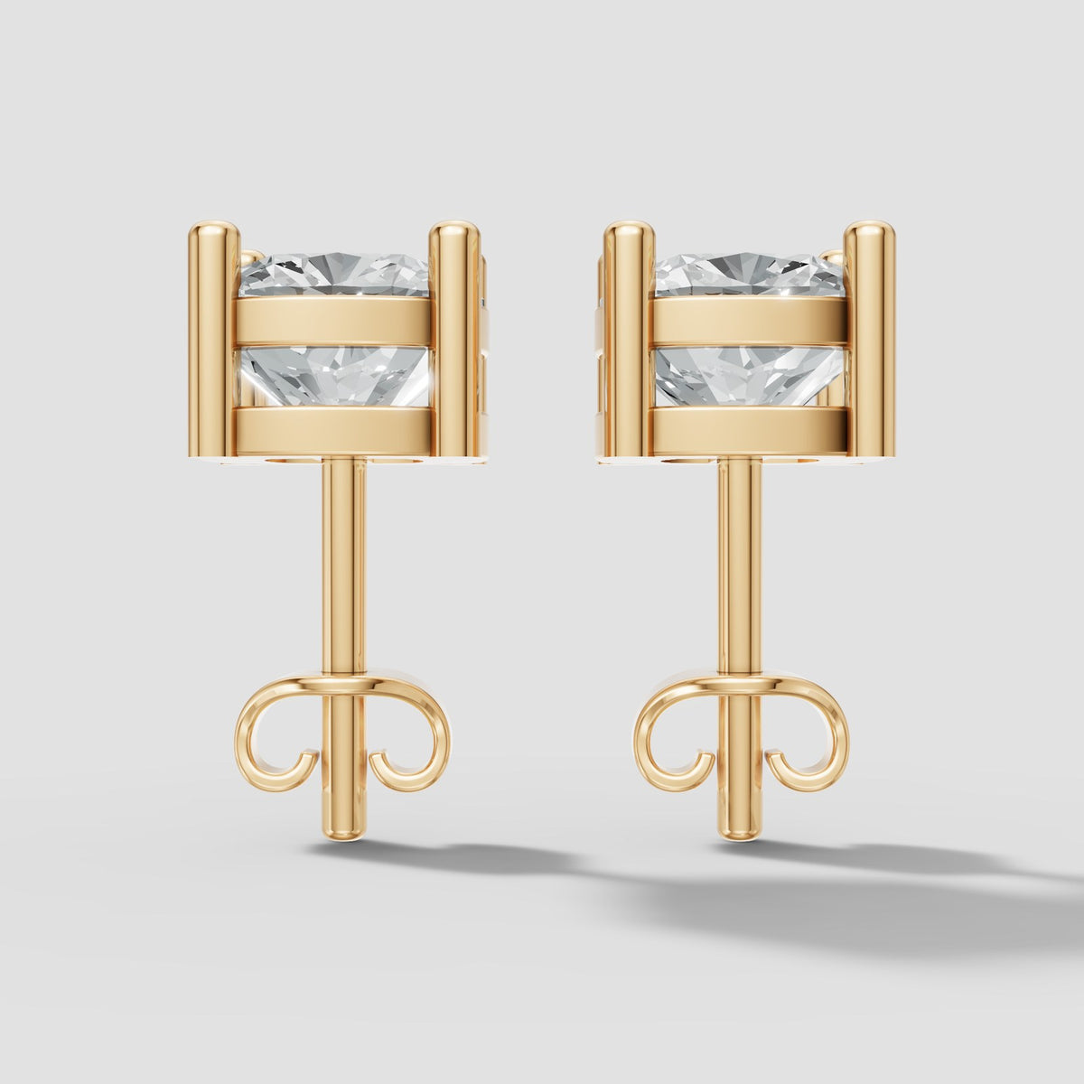 Cushion Four Prong Studs in Yellow Gold