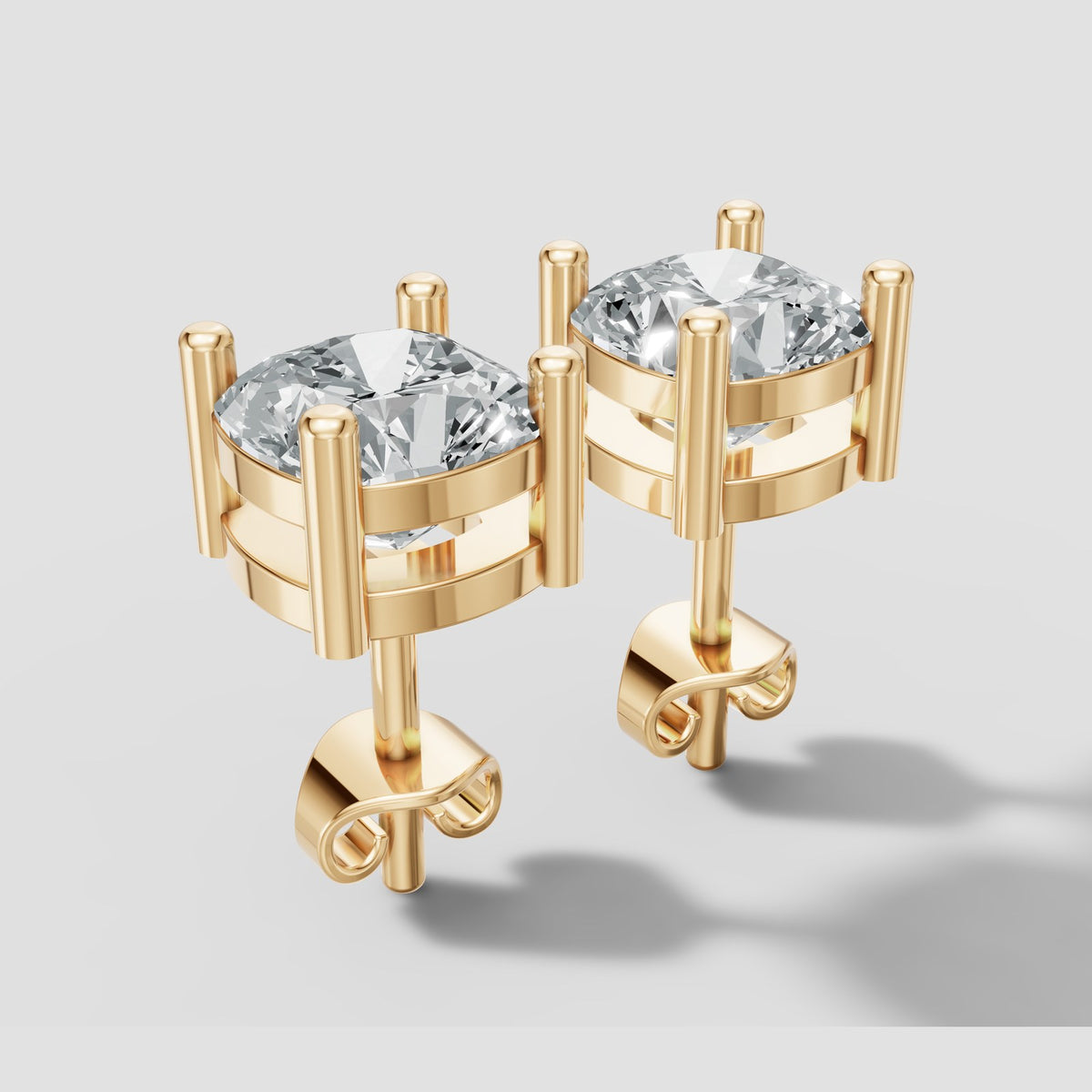 Cushion Four Prong Studs in Yellow Gold