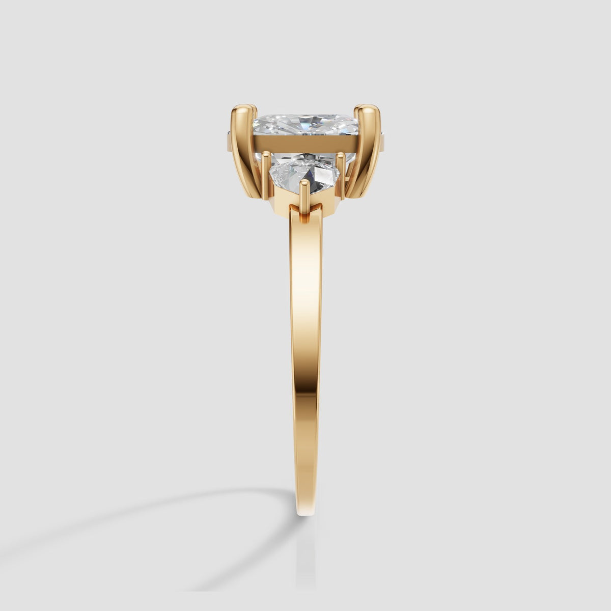 Hazel Cushion Three Stone in Yellow Gold