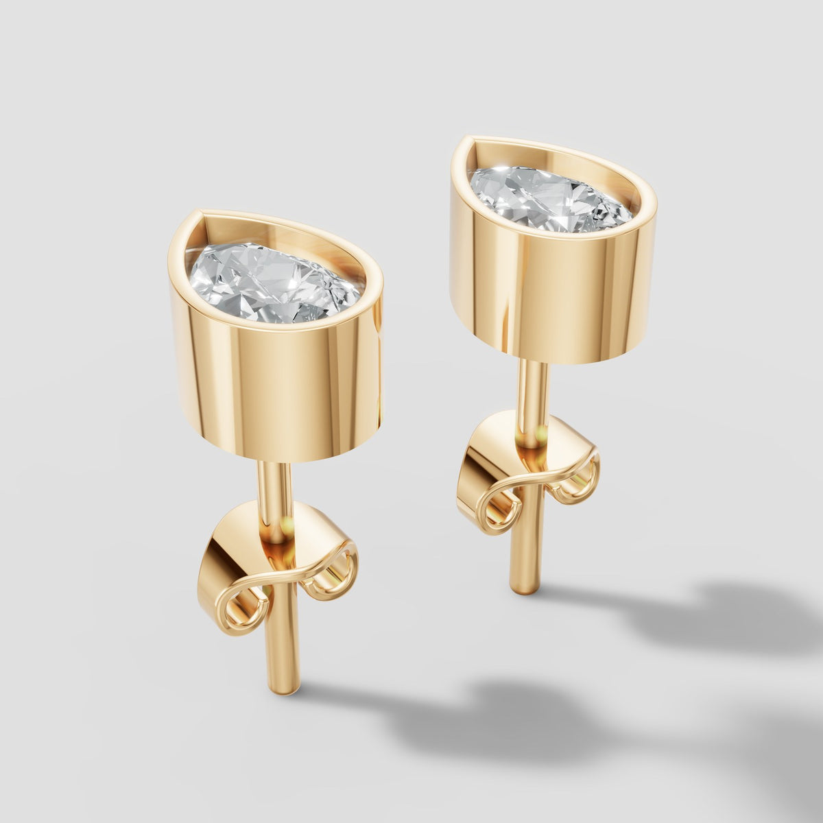 Pear Bezel Studs in Yellow Gold