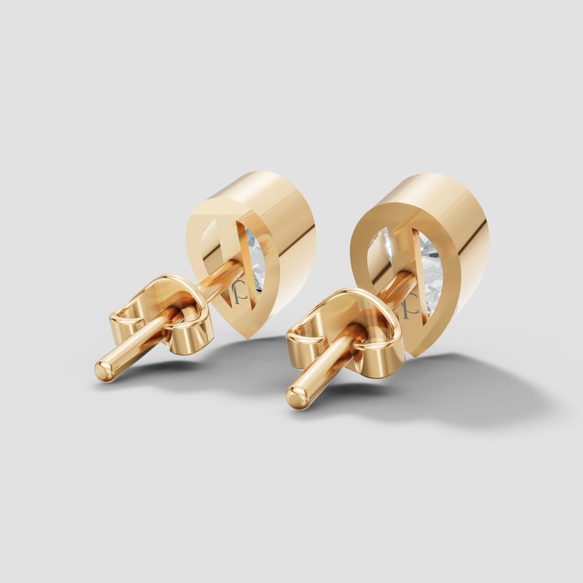 Pear Bezel Studs in Yellow Gold
