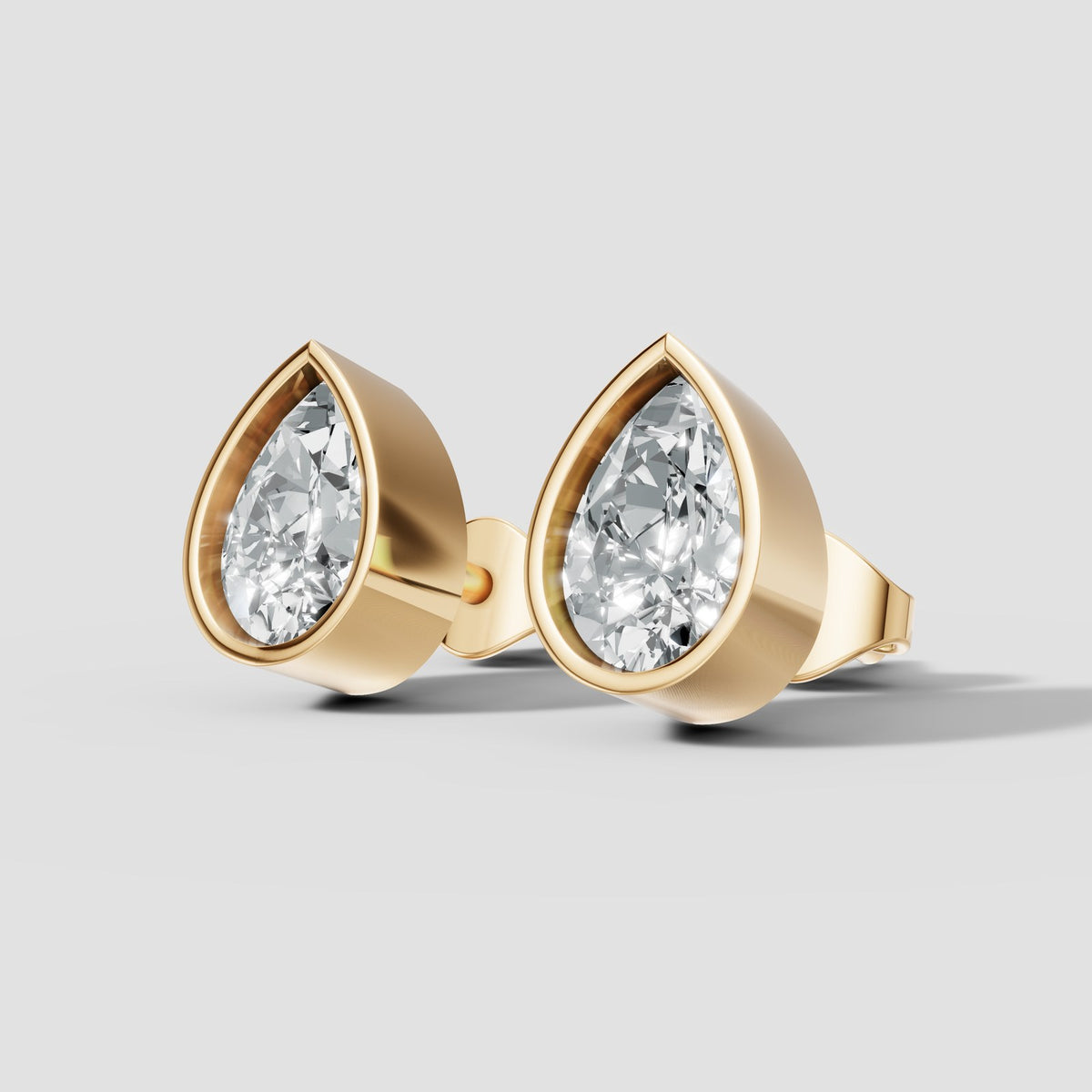 Pear Bezel Studs in Yellow Gold
